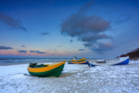 Fishing boats on the Baltic Sea beach in Jantar at winter. Polandの写真素材