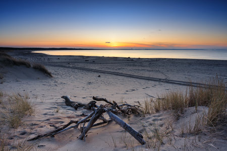 A beautiful sunset on the beach of the Sobieszewo Island at the Baltic Sea at spring. Polandの写真素材