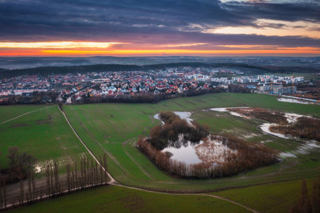 Amazing sunset over the wet spring fields in Polandの写真素材