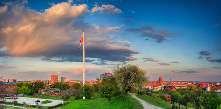 Beautiful blooming tree and the Main City of Gdansk at spring sunset, Polandの写真素材