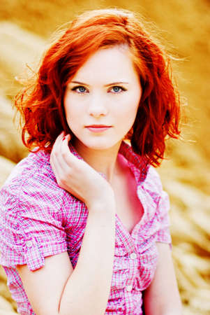 Beautiful young woman with red hairの写真素材