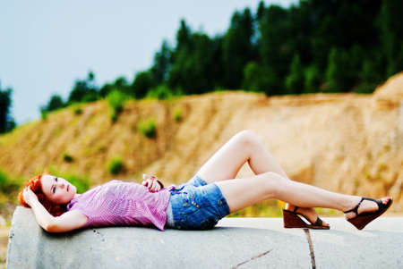 Beautiful young woman with red hairの写真素材