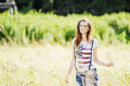 Portrait of the young beautiful woman outdoors