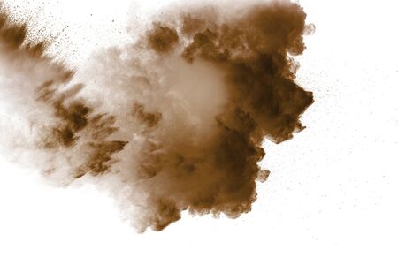 Freeze motion of brown dust explosion. Stopping the movement of brown powder. Explosive brown powder...