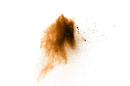 Brown color powder explosion  on white background.の写真素材
