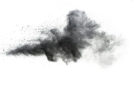 Black powder explosion.The particles of charcoal splash on white background.の写真素材