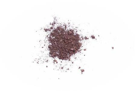 Deep brown crumbled eye shadow isolated on white background.Splatter make up and cosmetic products.の写真素材
