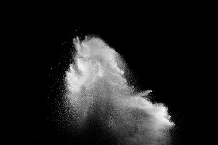 Abstract white powder dust explosion on black background.