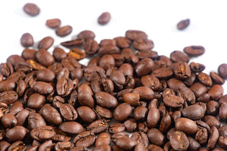 Coffee beans on white background.Fragrant fried coffee beans.