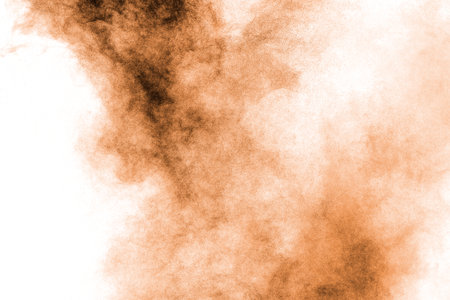 Freeze motion of brown dust explosion.Stopping the movement of brown powder.の写真素材