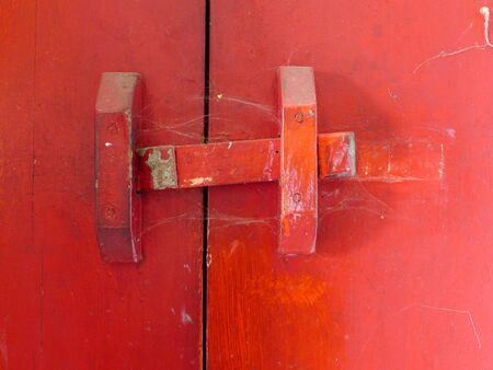 Old red wooden doorの写真素材
