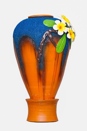 Jar decorated with molded flowers frangipani の写真素材