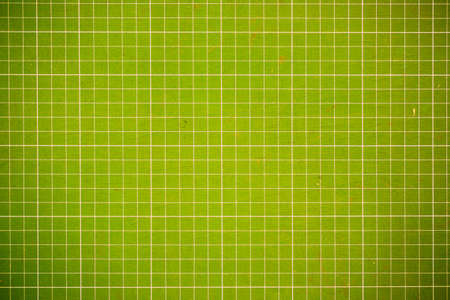 squared sheet texture yellow mix green backgroundの写真素材
