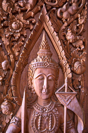 Wood carving on the window of the temple in Thailandの写真素材