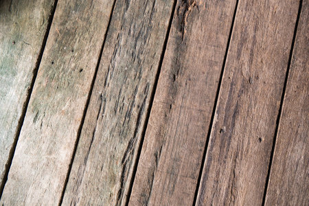 Old rough discolored wooden texture backgroundの写真素材