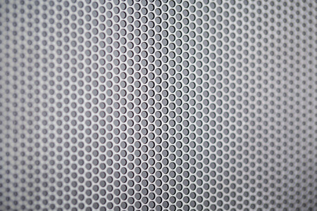 Chrome metal holed or perforated grid backgroundの写真素材