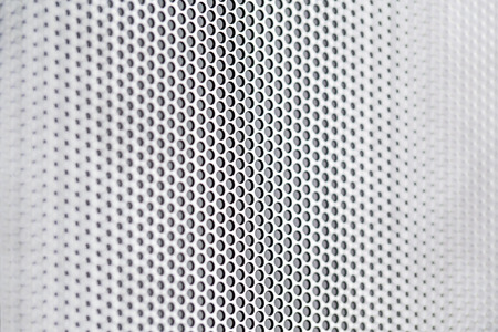 Chrome metal holed or perforated grid backgroundの写真素材