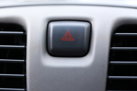 emergent of a warning button in a car
