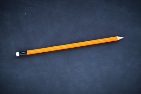Orange pencils on blue backgroundの写真素材