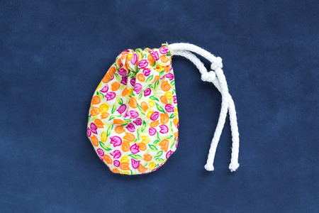 small bag pocket of hand made on blue backgroundの写真素材