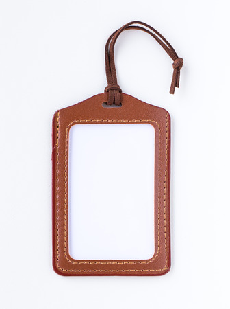 Brown leather label tag with string, isolated on the whiteの写真素材
