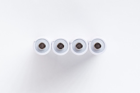 close up of AA size batteries isolated on white backgroundの写真素材