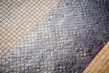 Abstract background of cobblestone pavement close-up.の写真素材
