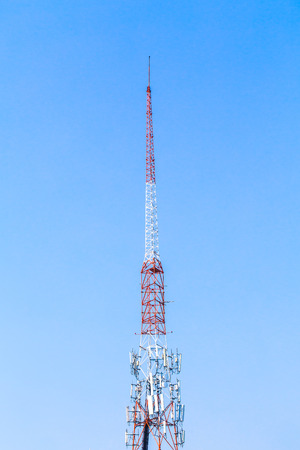 Telecommunication tower and blue skyの写真素材
