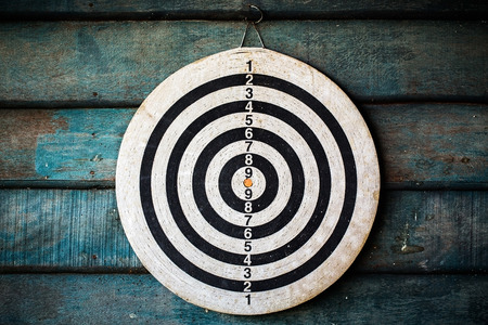 The darts isolated on wooden backgroundの写真素材