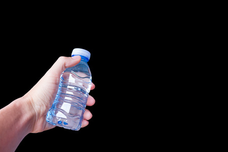 Water bottle with Hand on black Backgroundの写真素材