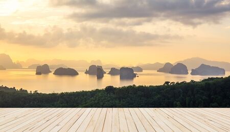Wooden Floor with soft morning light tone sea with numerous islands at Phuket Thailandの写真素材