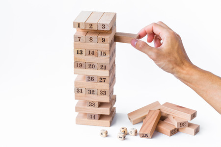 hand man play blocks wood, tower wooden game on white background.