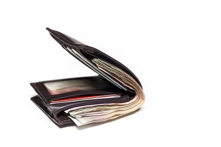 Picture concept with finance and banking. Brown leather wallet with money isolated on white backgroundの写真素材