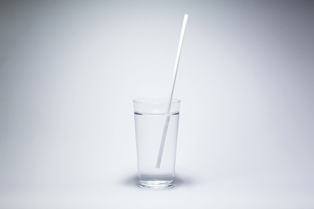 glass water drinking straws isolatedの写真素材