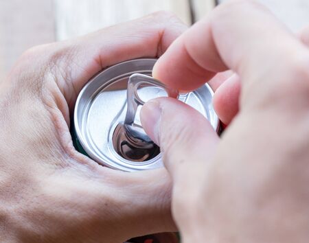 Abstract hand man open cans.の写真素材