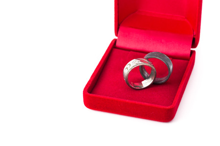 old metal ring jeweller red velvet box on white backgroundの写真素材