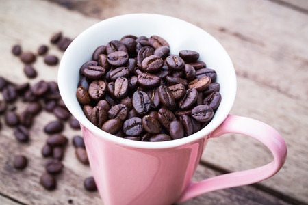 Abstract Love Coffee cup and beans on wooden background.の写真素材
