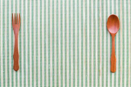 spoon wood kitchenware on bamboo mat background.の写真素材