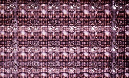intensive light tone of colorful glass block wall texture closeupの写真素材