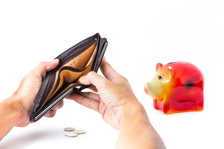 Empty wallet in his hands with Pig piggy bank saving. On a white background.の写真素材