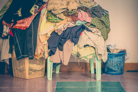 abstract vintage old tone of The basket with not folded clothes, clothes are not washの写真素材