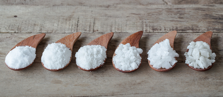 Sea salt on wooden table. spa saltの写真素材