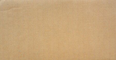 Brown paper texture for background. Seamless surface cardboard box for design. Backdrop recycle paper product or education concept.の写真素材