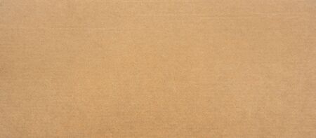 Brown paper texture for background. Seamless surface cardboard box for design. Backdrop recycle paper product or education concept.の写真素材