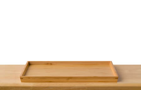 Empty sushi bamboo tray board on wood table white background. Bamboo products that have been processed into trays for use in the kitchen. Top view of plank wood for graphic stand design product.の写真素材