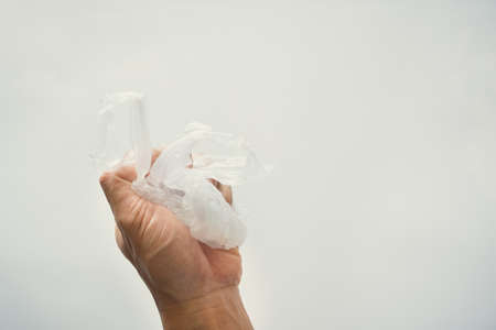 Empty plastic bag isolated on white background. Illustration of reducing plastic bags to help reduce global warmingの写真素材
