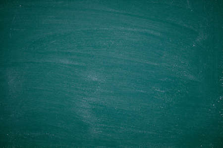 Green Chalkboard. Chalk texture school board display for background. chalk traces erased with copy space for add text or graphic design. Backdrop of Education conceptsの写真素材