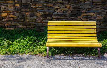 Abstract Yellow lounge chairs in the garden.の写真素材
