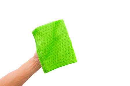 Abstract male hand holding green microfiber cleaning cloth on white. Background copy space for add text or art work design.の写真素材