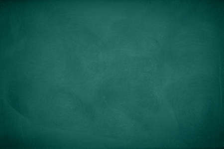 Green Chalkboard. Chalk texture school board display for background. chalk traces erased with copy space for add text or graphic design. Backdrop of Education conceptsの写真素材